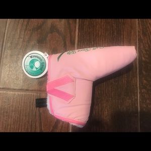 Two Golf putter head covers.